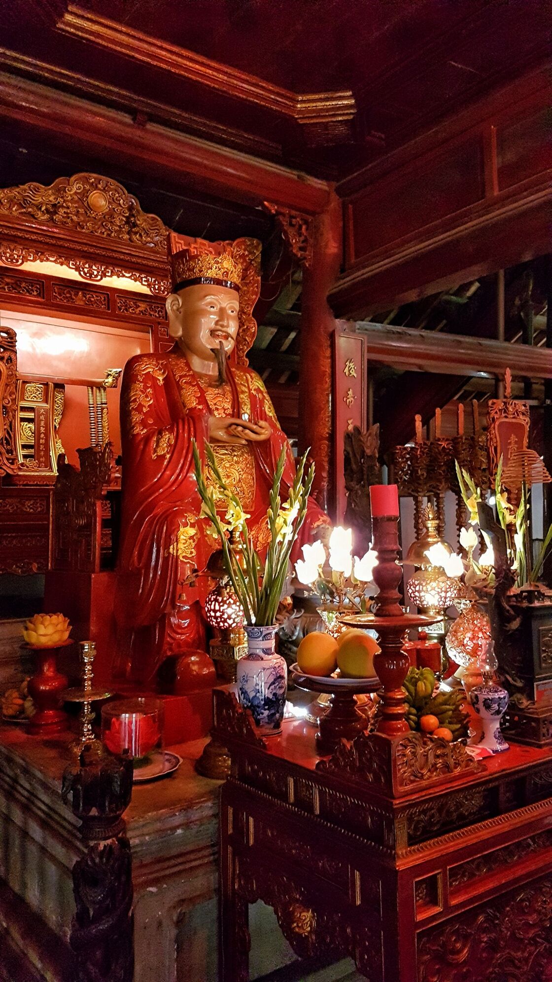 Confucianist altar with flower and fruit offerings at the Temple of Literature in Hanoi.  