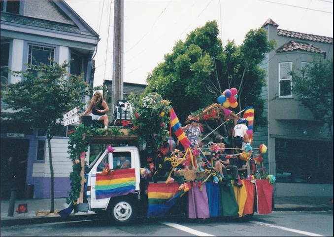 Vintage photos of a rainbow pride float in front of the Wild Side West bar. 