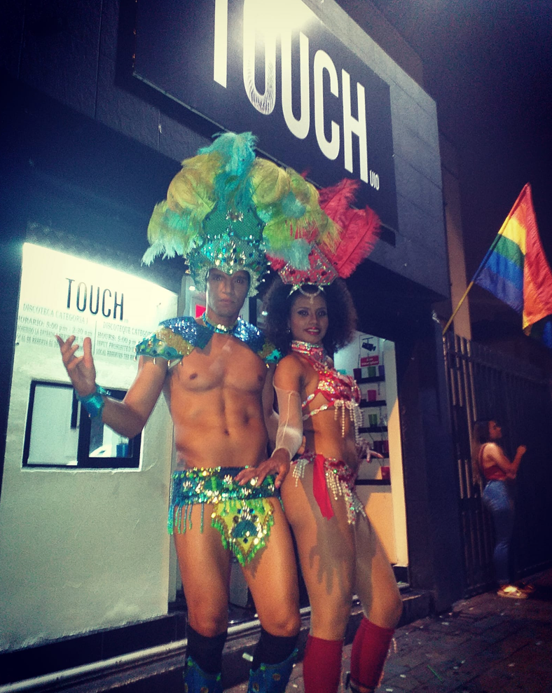 Dancers dressed in carnaval outfits outside a nightclub in Ecuador. 