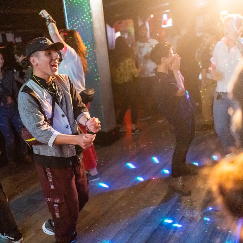 The dance floor at the Whitehorse Inn is full of people lost in music and jubilee.