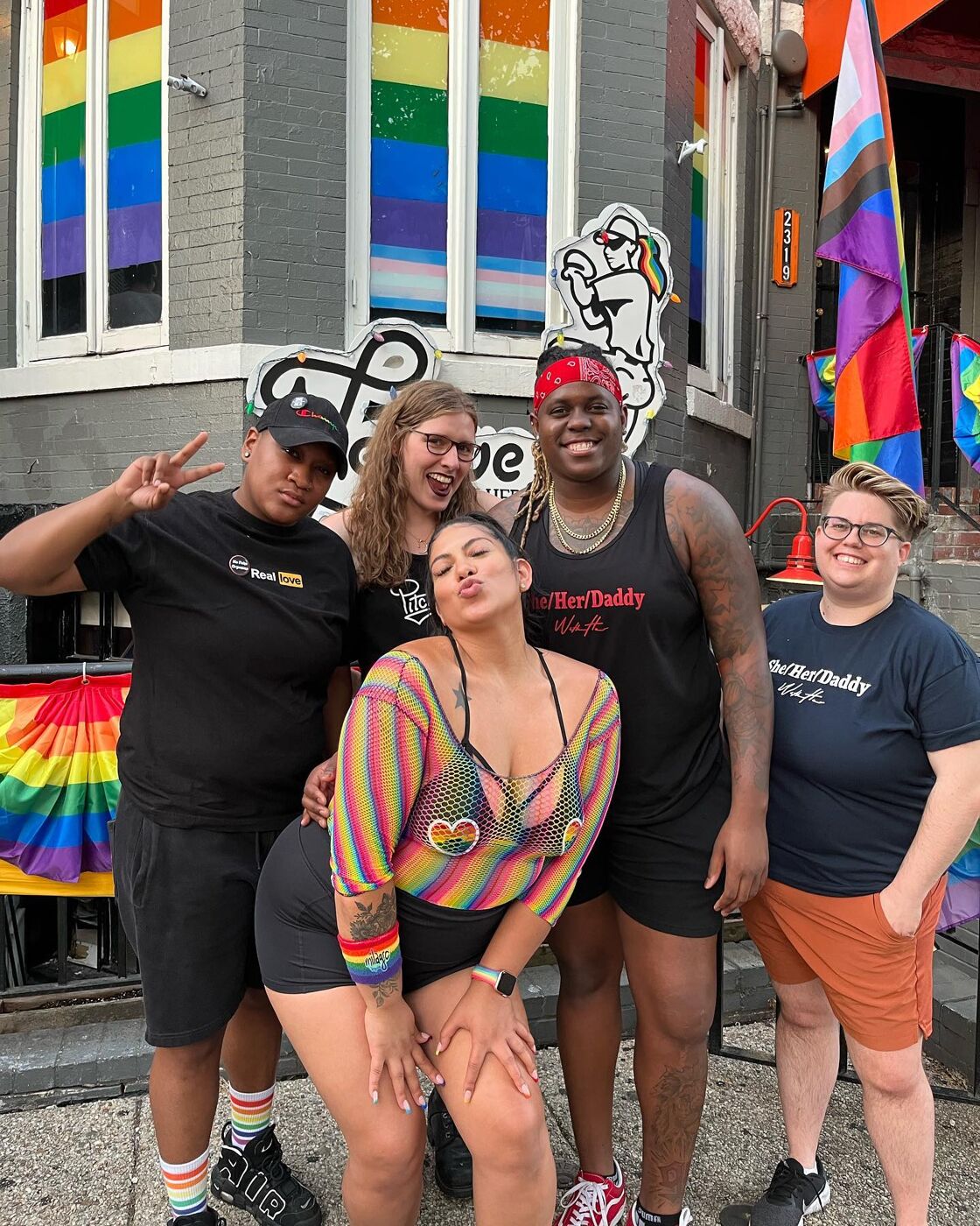 A group of friends poses outside A League of Her Own in Washington DC.