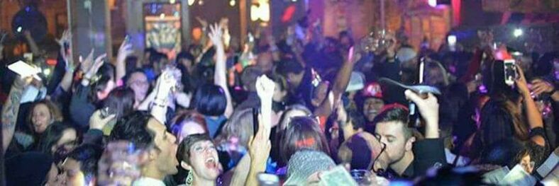 A crowd dances in a lesbian bar in Houston. 