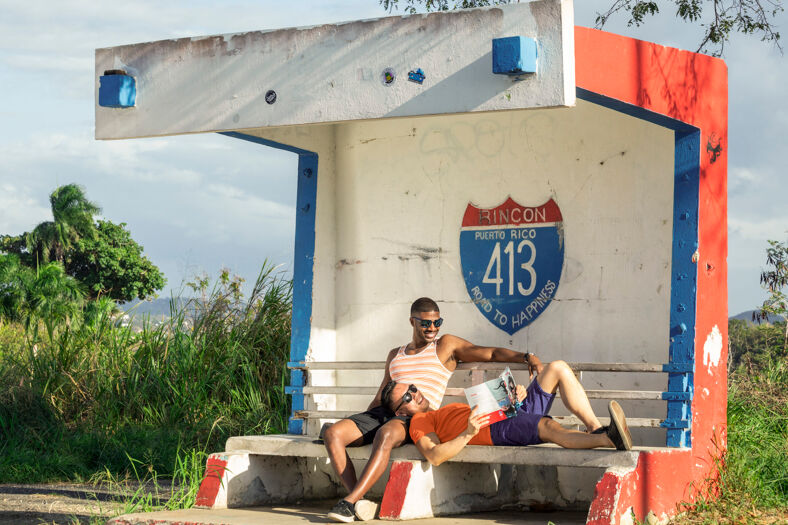 Two men waiting at a bus stop in Puerto Rico.