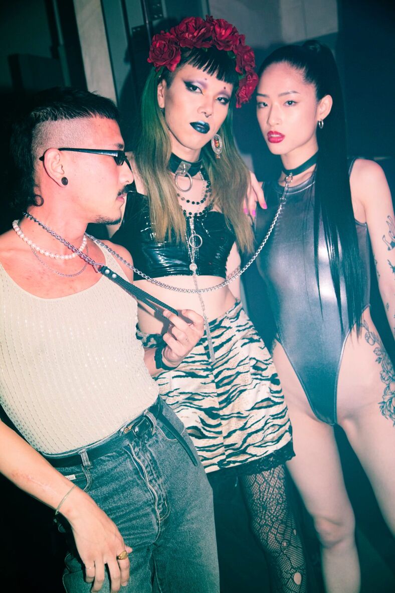 Three leather bond kinksters pose for the camera at a party at Pawhshop.