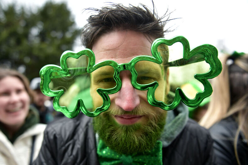 A man with clover shaped glasses 