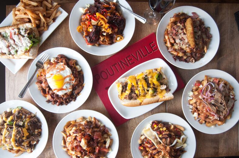 Different types of poutine grace the photo all smothered in cheese and various toppings.