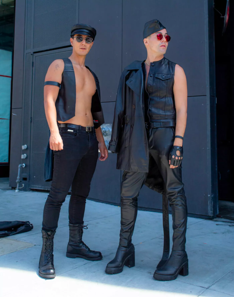 Two people dressed in leather at Folsom Street Fair.