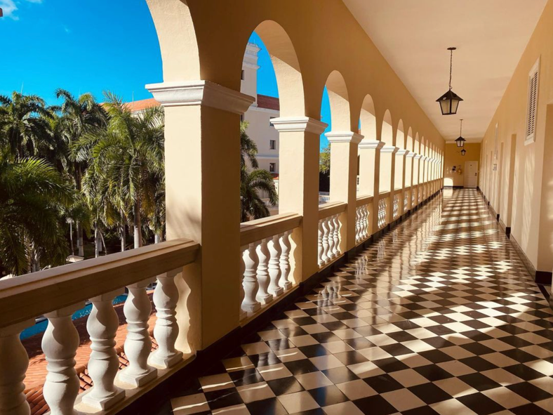 A tiled hallway at Hotel El Prado