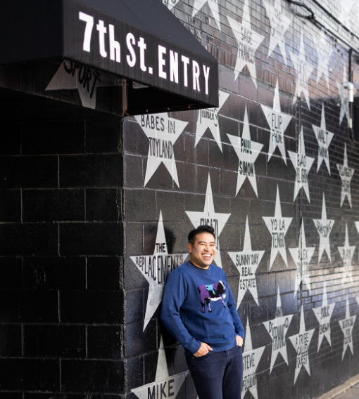 Thu Danh stands outside First Avenue, a nightclub where many of the great Minneapolis bands have played over the years. 