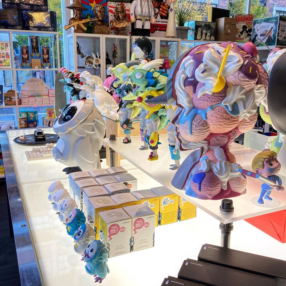 A countertop at Cult with various items displayed for sale.