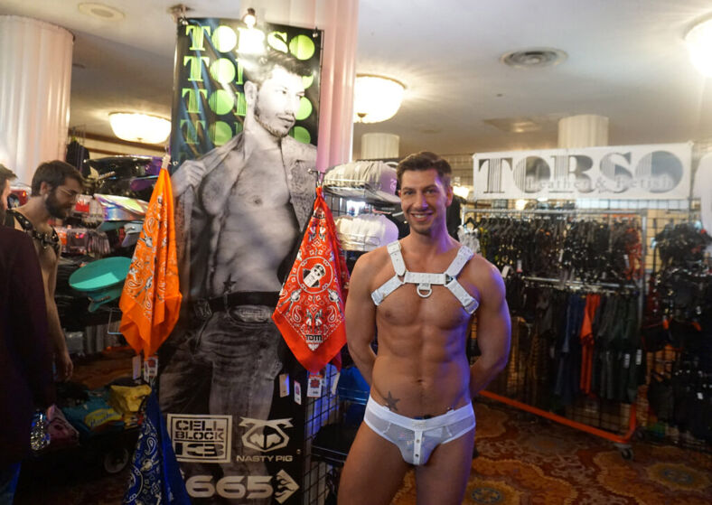 A model welcomes visitors at the TORSO booth.