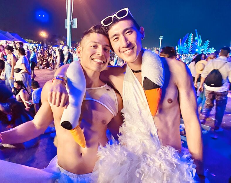 A queer couple sporting an homage to Bjork's infamous swan dress. The Icelandic diva was one of this year's Coachella performers.