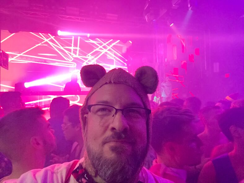 Greggor Mattson wearing animal ears inside a nightclub.