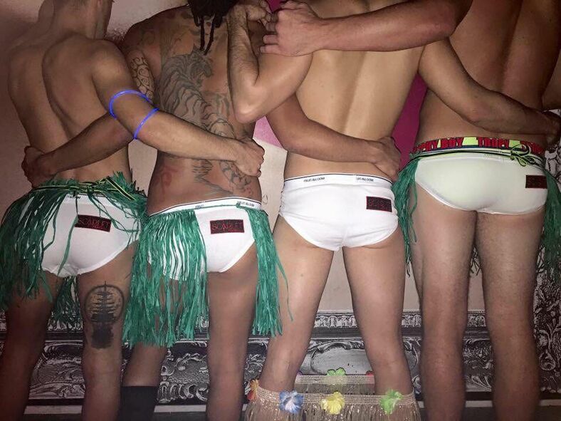 Four bums in white briefs.
