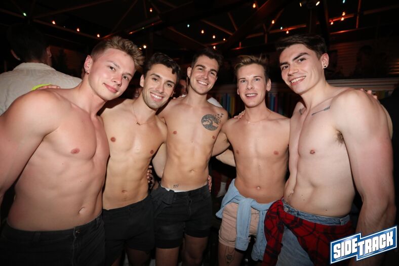A group of guys inside Sidetrack in Chicago.