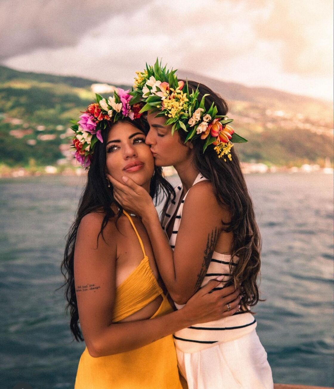 Kirstie Pike and Christine Diaz share a kiss in Tahiti.