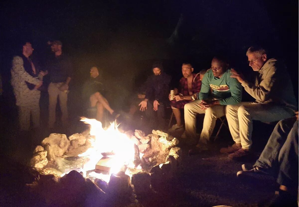 Men around a campfire.