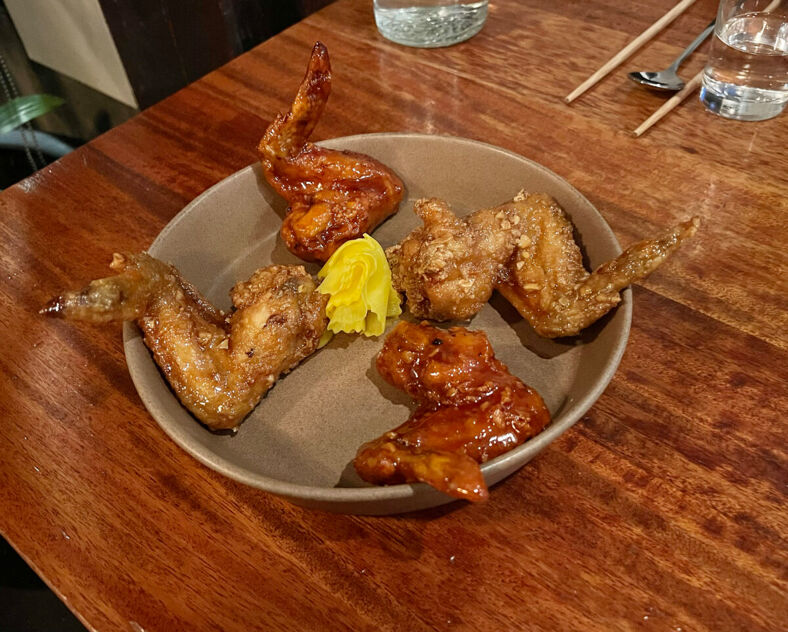 A plate of friend chicken wings