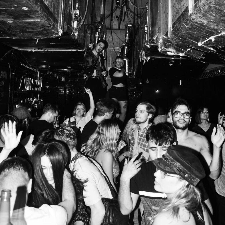 Revelers dance at Club Backdoor in a room that resembles a walk-in freezer.