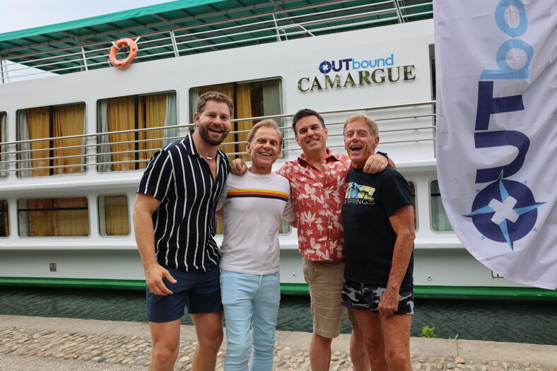 Jaymes Vaughan, left, and guests aboard an OUTbound river cruise
