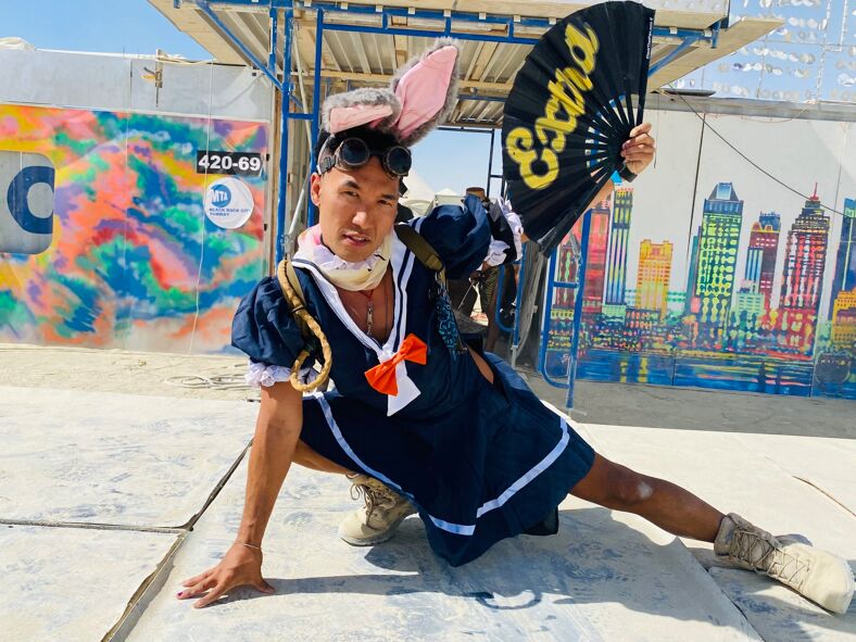 Pole dance instructor Victor "Hoops" Tang working the Kostume Kult  catwalk at Burning Man 2022.