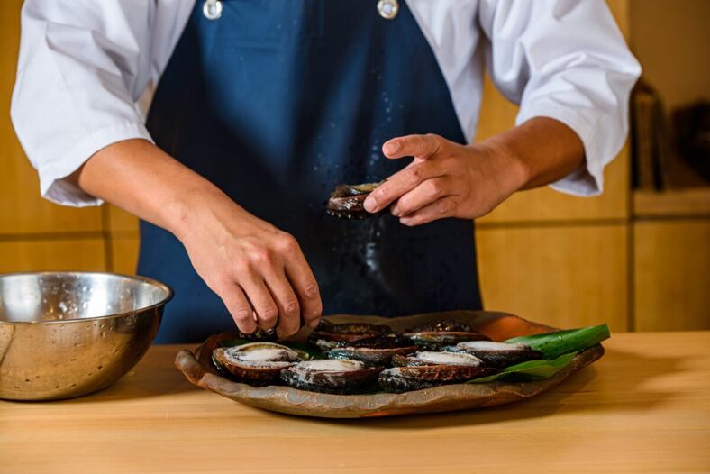 Chef prepares food at Sushi Ginza Onodera in Honolulu.