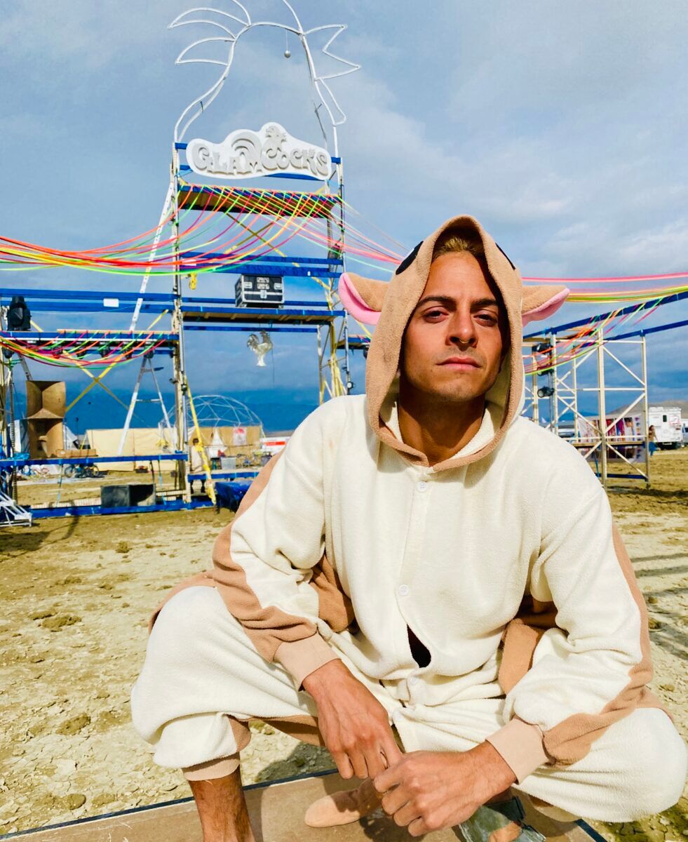 LA-based Glamcock Lotus roosting in his camp's 'Cockyard.'