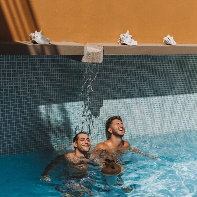 Two guys in a swimming pool