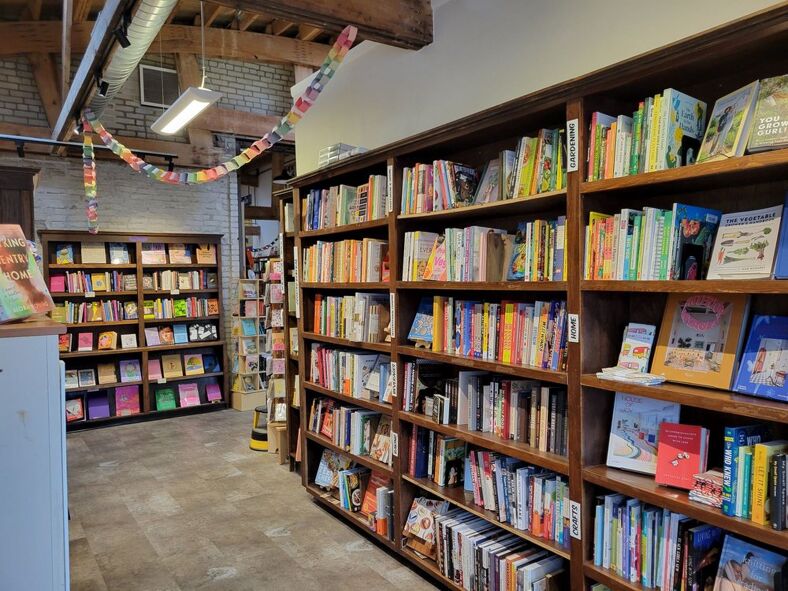 The shelves of LGBTQ+ bookstore, A Room of One's Own.