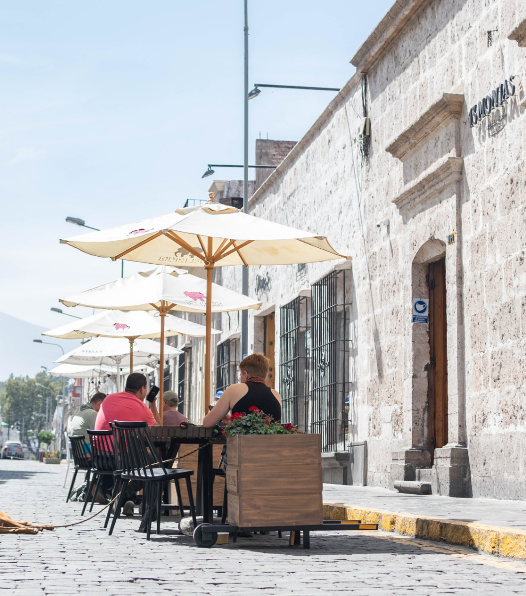 Street view of Arquipa, Peru. The building and street are made of white stone.