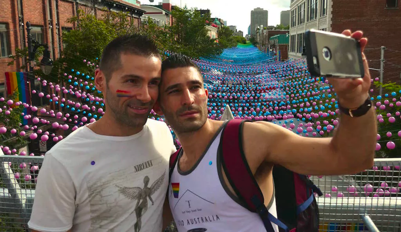 Selfie over Montreal's gay village rainbow balls