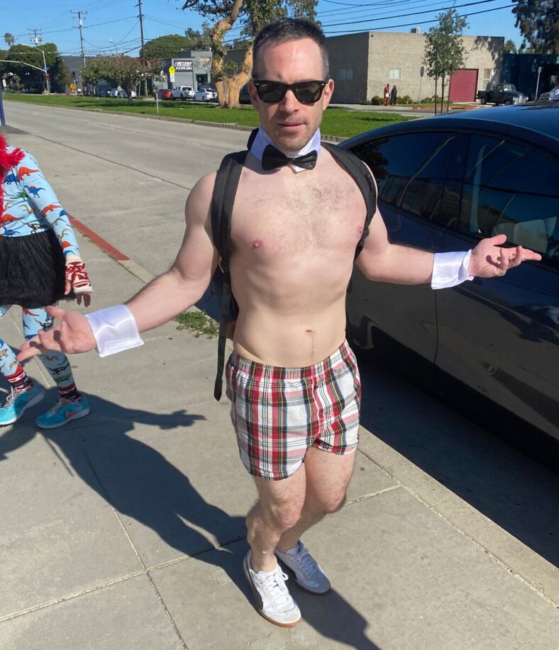 A runner in plaid boxers and bow tie.