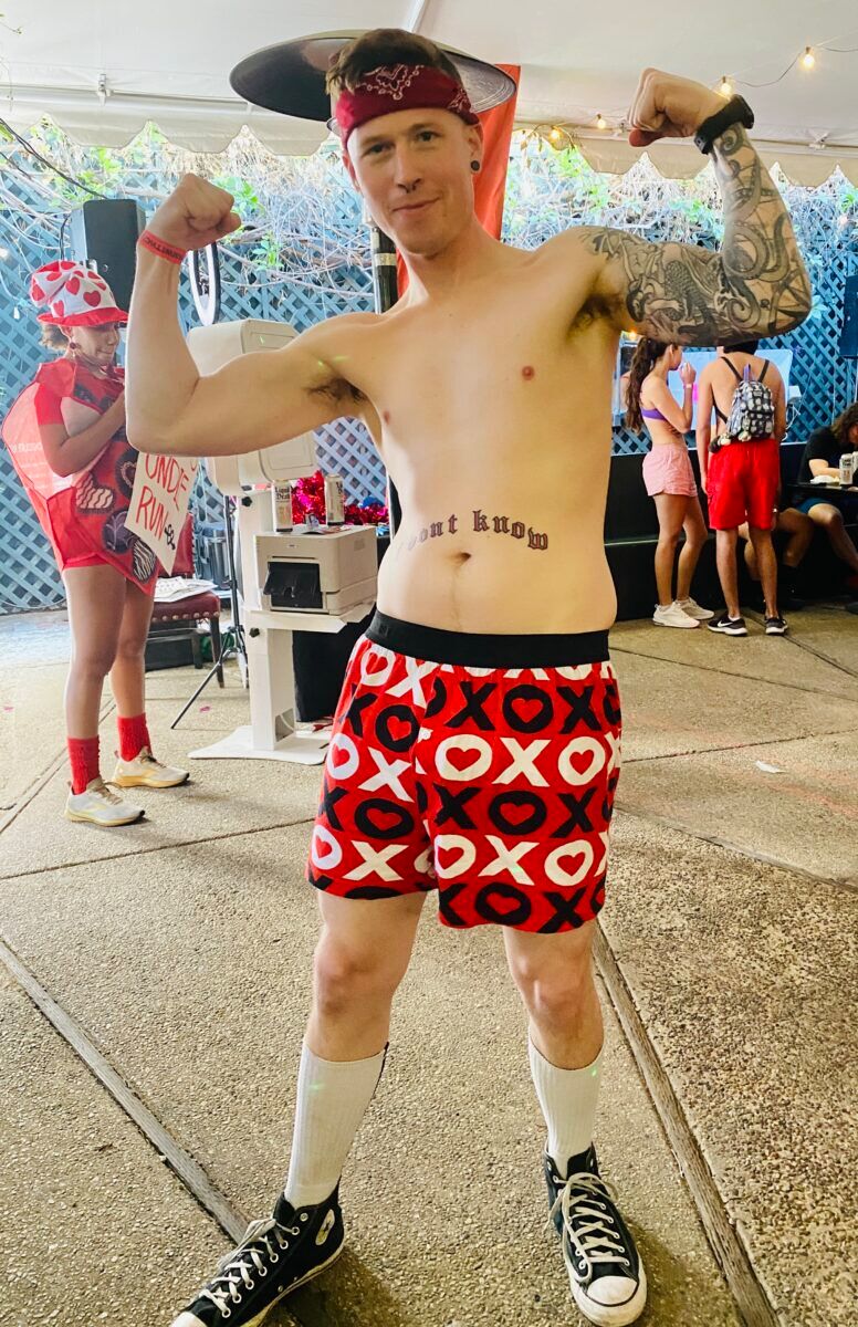 Nate aka Tater flexing his biceps at the Cupid's Undie Run after party.