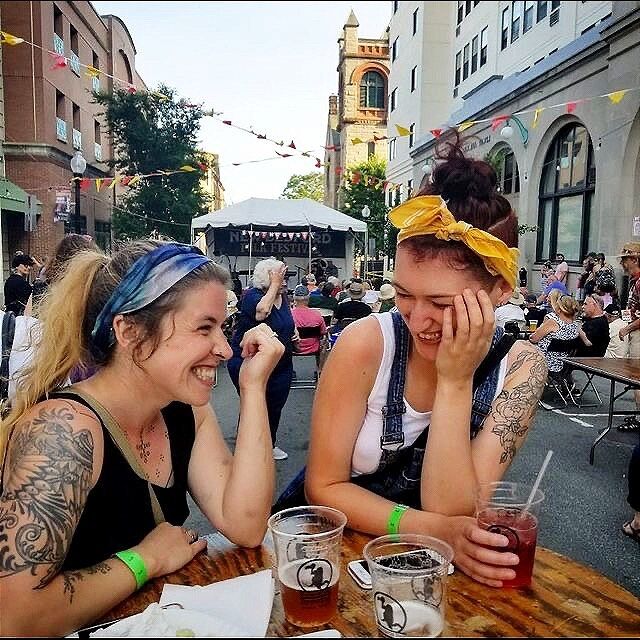A female couple enjoys drinks in downtown New Bedford.