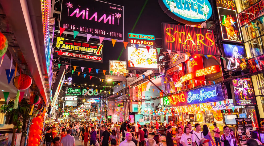 Neon signs in Pattaya, one of the LGBTQ hotspots in Thailand. The scene is the busy "Walking Street" which is full of go-go bars and night clubs, main tourists attraction