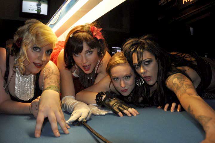 Four ladies on the pool table at The Depot in Sacramento. 
