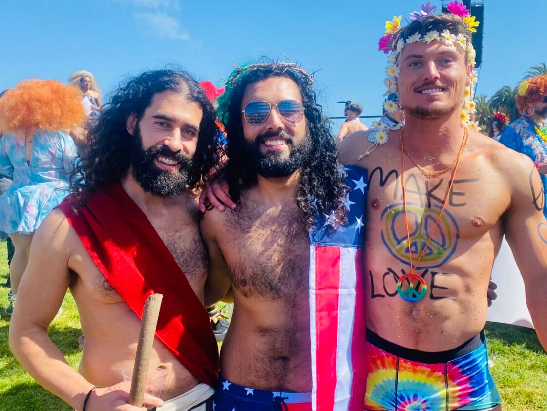 A trio of Hunky Jesus contestants posing for a photo before the competition.
