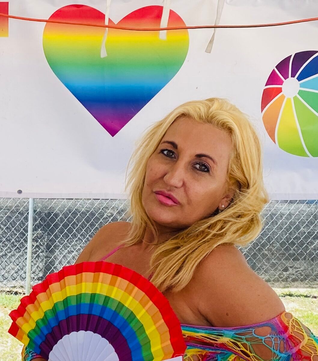 Local personality Frenchie tending bar at the Miami Beach Pride festival.