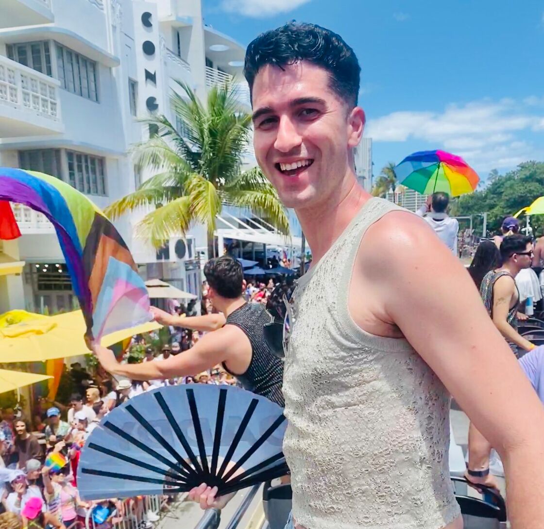 David Pallares serving a metallic tank top on on a futurism themed Pride float.