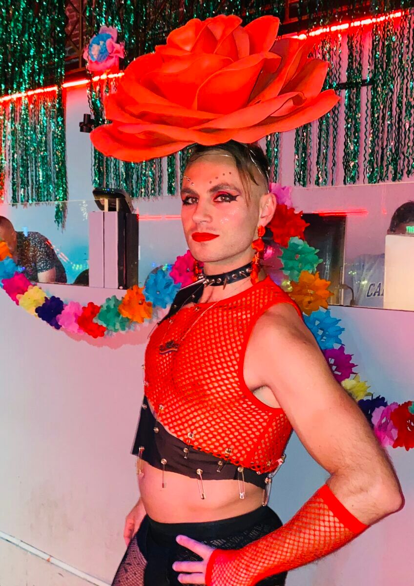 SF Glamcock sartorialist Badger serving red rose couture.