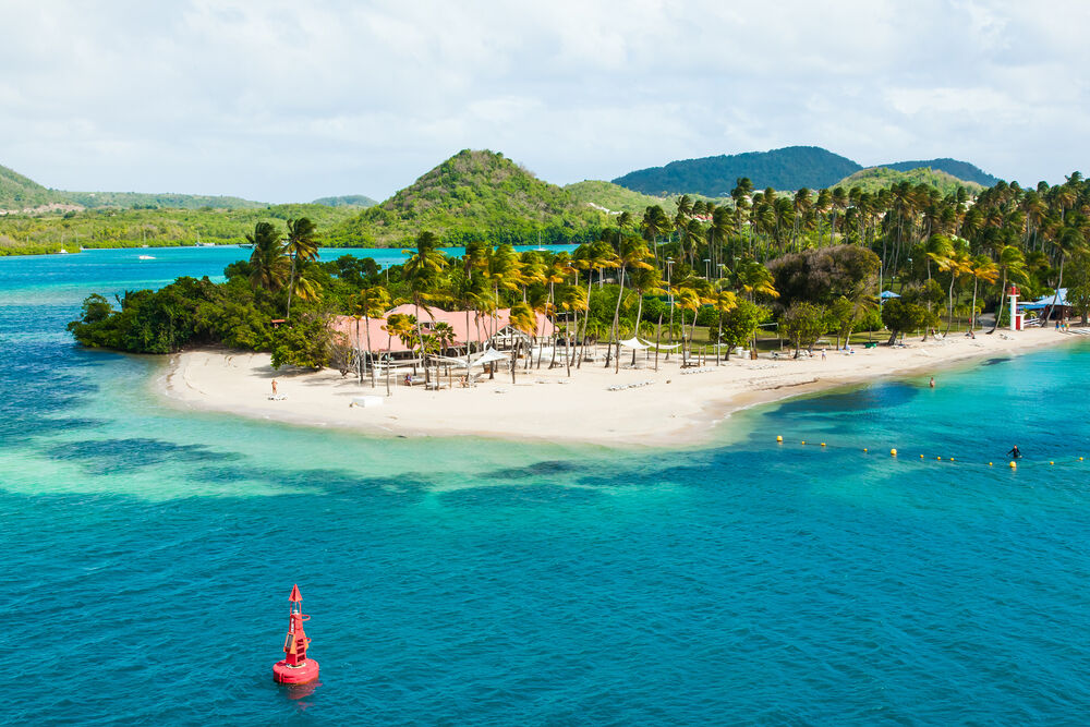The coast of the Caribbean island of Martinique French Polynesia. Beaches with turquoise water and palm trees.