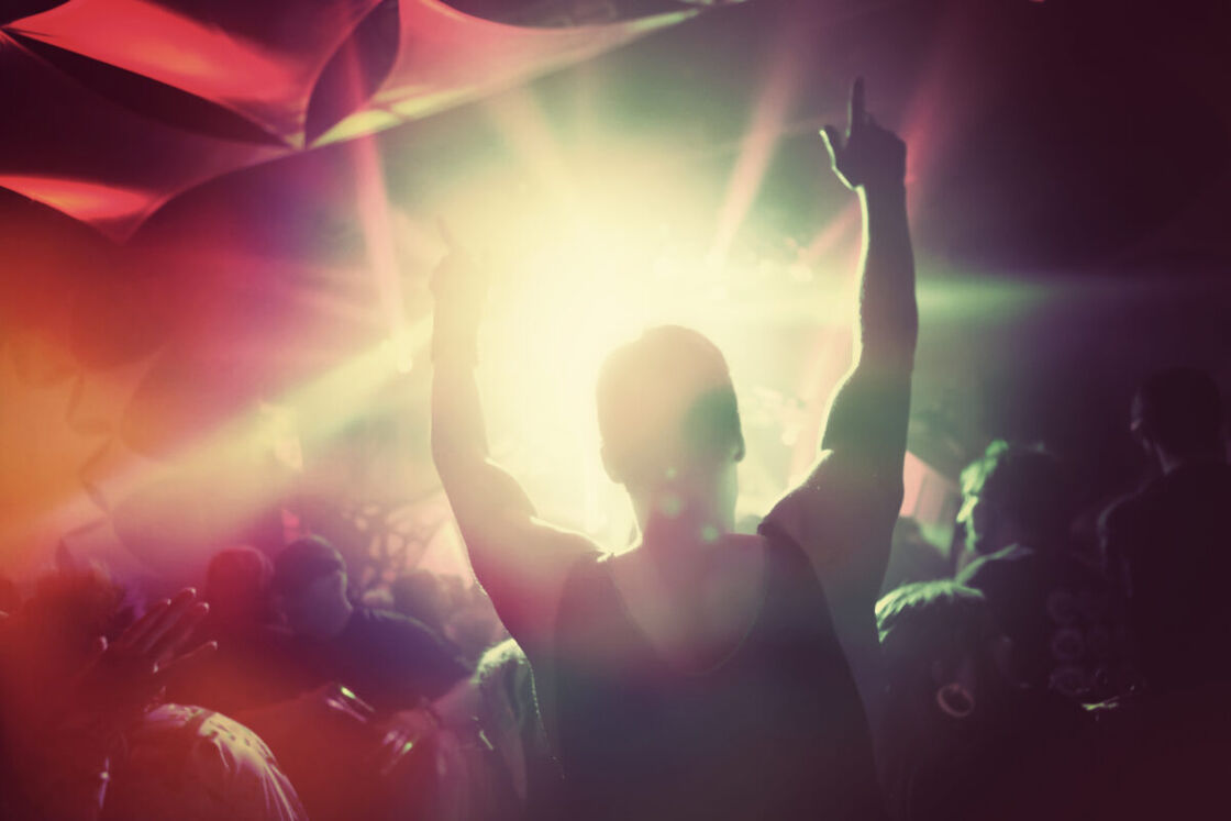 A man dances at a music festival.
