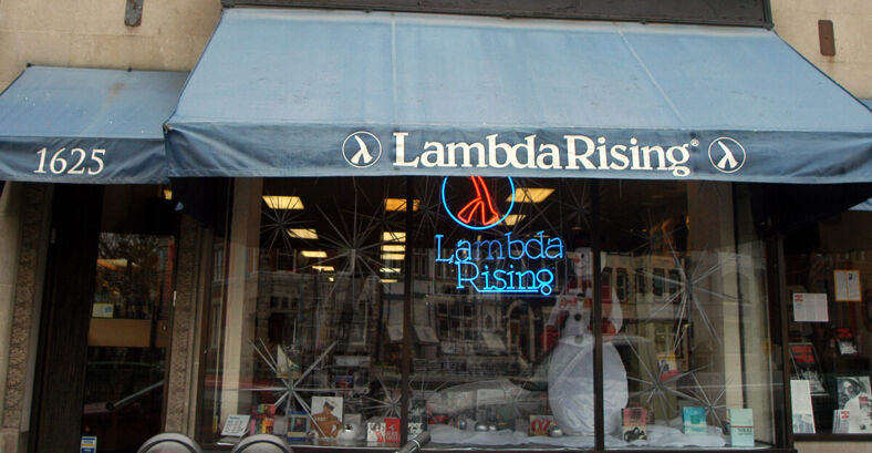 The front of the Lambda Rising bookshop store with a Christmas-themed window display. 