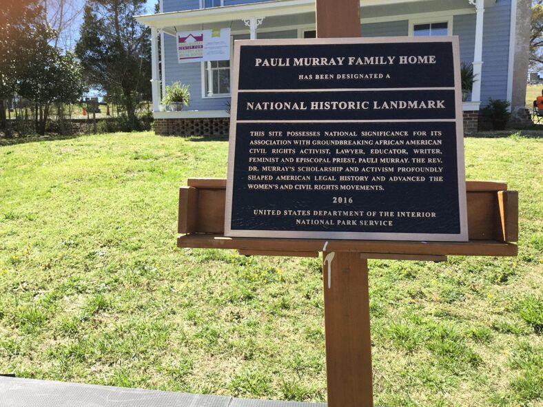 A sign in front of the Pauli Murray Center indicating the venue as a National Historic Landmark. 