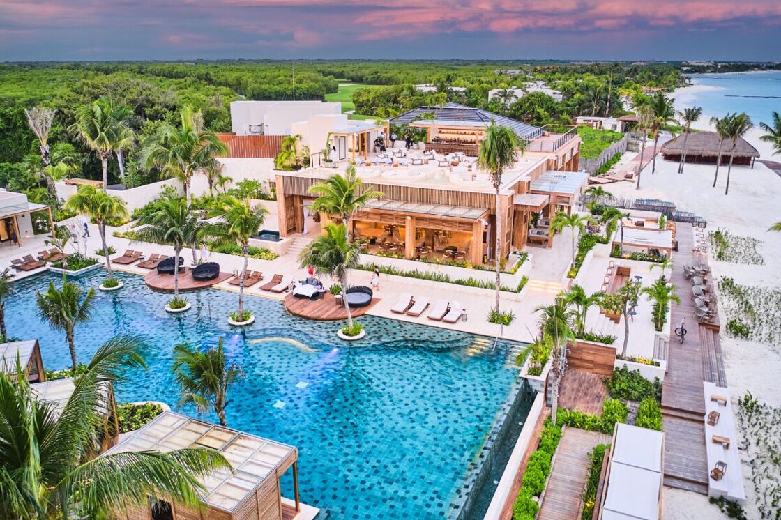 Fairmont Mayakoba Resort pool and surrounding buildings. Photo via Fairmont Mayakoba