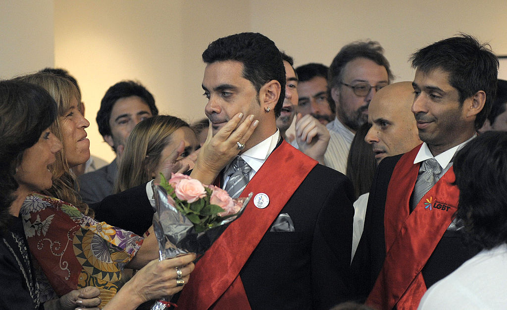 Alejandro Freyre (C) and Jose Maria Di Bello (R) arrive to a news conference.
