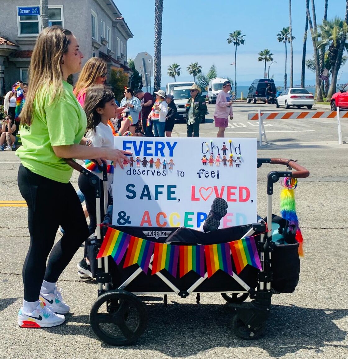 A proud mom with wagon at Long Beach Pride
