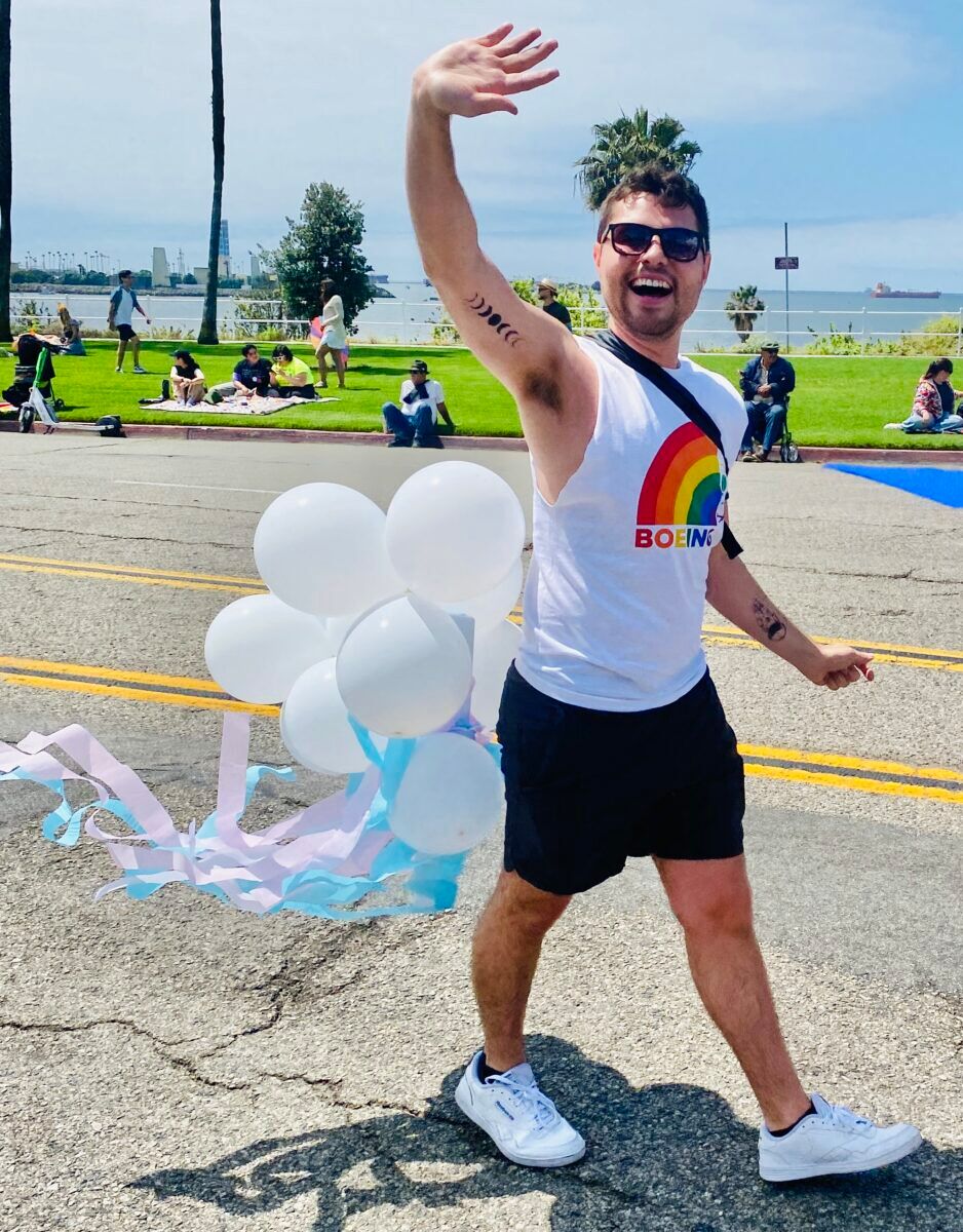 Boy with white balloons
