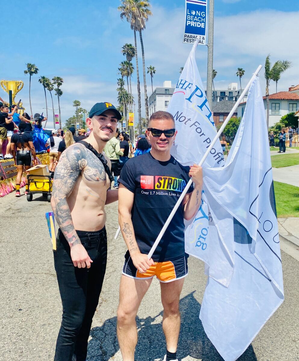 Shirtless dude with tattoos and his friend