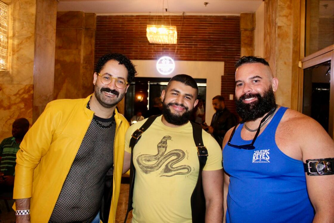 Three men pose for the camera at IML.